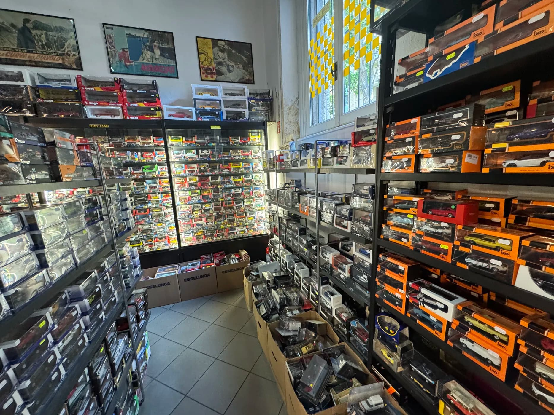 A narrow shop stacked floor to ceiling with boxed die-cast model cars